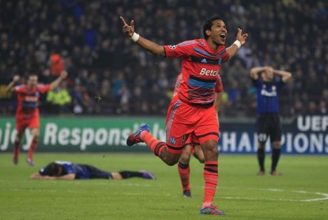 Marseille Brazilian forward Brandao celebrates after scoring during a second leg Champions League round of 16 soccer match, at the San Siro stadium, in Milan, Italy, Tuesday, March, 13, 2012. Inter won 2-1 and Marseille advances on a 2-2 aggregate. (AP Photo/Luca Bruno)