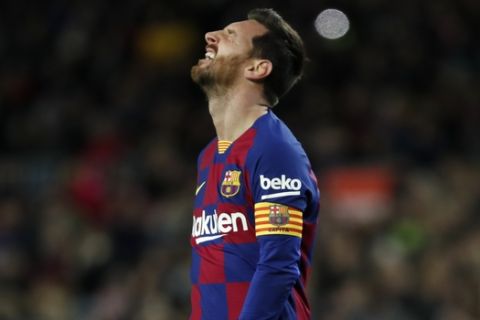 Barcelona's Lionel Messi reacts after a missed chance to score during a Spanish La Liga soccer match between Barcelona and Granada at Camp Nou stadium in Barcelona, Spain, Sunday, Jan. 19, 2020. (AP Photo/Joan Monfort)