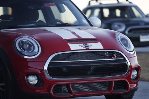 In this Sunday, Jan. 7, 2018, photograph, unsold 2018 Mini Coopers sit on a dealer's lot in Highlands Ranch, Colo. (AP Photo/David Zalubowski)