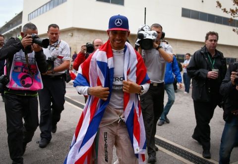 AUSTIN, TX - OCTOBER 25:  Lewis Hamilton of Great Britain and Mercedes GP celebrates in the paddock after winning the United States Formula One Grand Prix and the championship at Circuit of The Americas on October 25, 2015 in Austin, United States.  (Photo by Clive Mason/Getty Images)