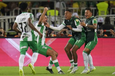Jarlan Barrera of Colombia's Atletico Nacional, second from the left, celebrates scoring his side's third goal against Argentina's Racing Club during a Copa Libertadores round of 16 first leg soccer match at Atanasio Girardot stadium in Medellin, Colombia, Thursday, Aug. 3, 2023. (AP Photo/Fernando Vergara)