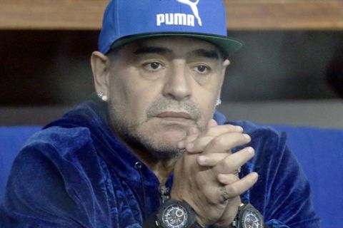 FILE - A Friday, Nov. 25, 2016 file photo showing Argentina's soccer legend Diego Maradona watching the Davis Cup finals tennis singles match between Croatia's Marin Cilic and Argentina's Federico Delbonis in Zagreb, Croatia. Former Napoli star Diego Maradona is in talks to work with the Serie A side, where he is still idolized nearly 27 years after leaving the club. Maradona, who is in Naples for a theatrical event on Monday celebrating the club's first title win, met with Napoli President Aurelio de Laurentiis on Saturday night, Jan 14, 2017. (AP Photo/Darko Bandic, File)