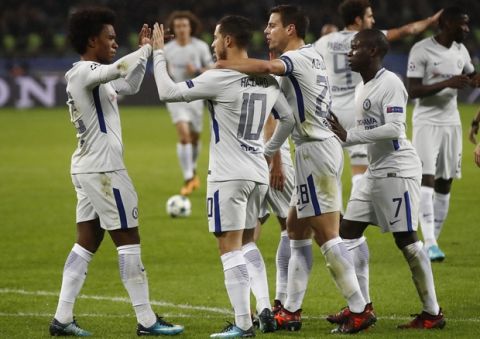 Chelsea's Eden Hazard, (10) celebrates with teammates after scoring the opening goal of the game from the penalty spot during their Champions League, group C, soccer match between Qarabag FK and Chelsea at the Baku Olympic stadium in Baku, Azerbaijan, Wednesday, Nov. 22, 2017. (AP Photo/Pavel Golovkin)