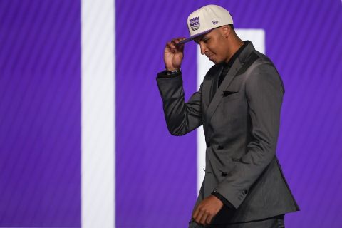 Keegan Murray walks across the stage after being selected fourth overall by the Sacramento Kings in the NBA basketball draft, Thursday, June 23, 2022, in New York. (AP Photo/John Minchillo)