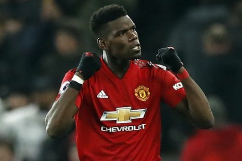 Manchester United's Paul Pogba celebrates after the final whistle of the English Premier League soccer match between Manchester United and Brighton at Old Trafford, Manchester, England, Saturday, Jan. 19, 2019. (Martin Rickett/PA via AP)