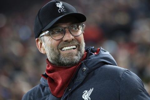 Liverpool's manager Jurgen Klopp smiles before the start of the Champions League group E soccer match between Liverpool and Genk at Anfield Stadium, Liverpool, England, Tuesday, Nov. 5, 2019. (AP Photo/Jon Super)