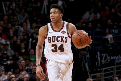 MILWUAKEE, WI - JANUARY 5:  Giannis Antetokounmpo #34 of the Milwaukee Bucks handles the ball against the Toronto Raptors on January 5, 2018 at the BMO Harris Bradley Center in Milwaukee, Wisconsin. NOTE TO USER: User expressly acknowledges and agrees that, by downloading and or using this Photograph, user is consenting to the terms and conditions of the Getty Images License Agreement. Mandatory Copyright Notice: Copyright 2018 NBAE (Photo by Gary Dineen/NBAE via Getty Images)