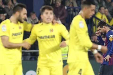 Barcelona forward Lionel Messi, right, reacts after Villarreal scored their fourth goal during the Spanish La Liga soccer match between Villarreal and FC Barcelona at the Ceramica stadium in Villarreal, Spain, Tuesday, April 2, 2019.(AP Photo/Alberto Saiz)