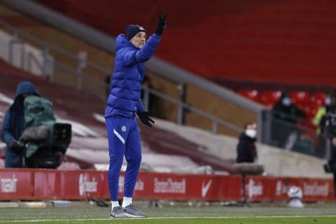Chelsea's head coach Thomas Tuchel gives instructions during the English Premier League soccer match between Liverpool and Chelsea at Anfield stadium in Liverpool, England, Thursday, March 4, 2021. (Phil Noble, Pool via AP)