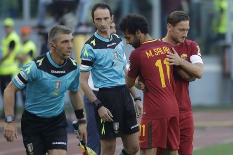 Roma Francesco Totti, right, enters the field for Mohamed Salah during an Italian Serie A soccer match between Roma and Genoa at the Olympic stadium in Rome, Sunday, May 28, 2017. Francesco Totti is playing his final match with Roma against Genoa after a 25-season career with his hometown club. (AP Photo/Alessandra Tarantino)