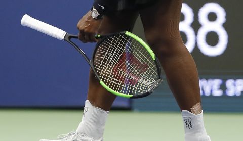 Serena Williams picks up her racket after having her serve broken by Naomi Osaka, of Japan, during the women's final of the U.S. Open tennis tournament, Saturday, Sept. 8, 2018, in New York. (AP Photo/Adam Hunger)