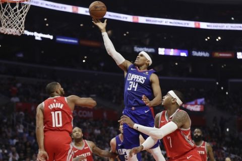 Los Angeles Clippers' Tobias Harris (34) drives to the basket against the Houston Rockets during the first half of an NBA basketball game Sunday, Oct. 21, 2018, in Los Angeles. (AP Photo/Marcio Jose Sanchez)