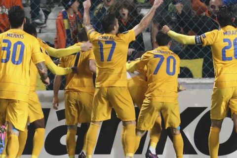 APOEL's players celebrate after teammate Pieros Sotiriou scores a goal against Athletic Bilbao during the Europa League round of 32 second leg soccer match between APOEL and Athletic Bilbao at the GSP stadium, in Nicosia, Cyprus, on Thursday, Feb. 23, 2017. (AP Photo/Petros Karadjias)