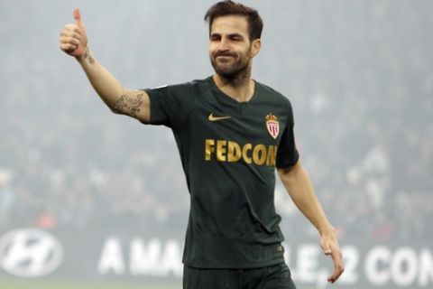 FILE - In this Sunday, Jan. 13, 2019 file photo, Monaco midfielder Cesc Fabregas gestures during the League One soccer match between Marseille and Monaco at the Velodrome stadium, in Marseille, southern France. Former Arsenal teammates, Thierry Henry and Cesc Fabregas are back together at Monaco, where Henrys first coaching role is turning into a desperate battle against relegation. (AP Photo/Claude Paris, File)