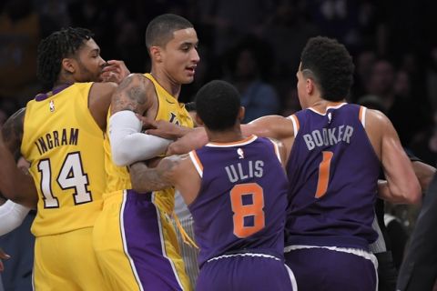 Los Angeles Lakers forward Brandon Ingram, left, and forward Kyle Kuzma, second from left, scuffle with Phoenix Suns guard Tyler Ulis, second from right, and guard Devin Booker during the second half of an NBA basketball game, Friday, Nov. 17, 2017, in Los Angeles. The Suns won 122-113. (AP Photo/Mark J. Terrill)