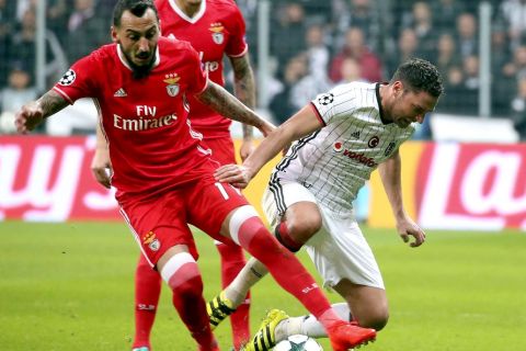 Bayern's Douglas Costa, front, goes to Benfica's Kostas Mitroglou, left, of Greece, dribbles past Besiktas' Dusko Tosic, right, during their Champions League Group B soccer match, in Istanbul, Wednesday, Nov. 23, 2016. (AP Photo)