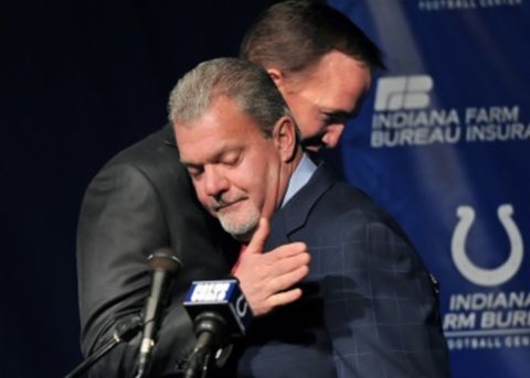 Indianapolis Colts owner Jim Irsay hugs quarterback Peyton Manning as Manning prepares to take the microphone after Irsay announced that the Colts are letting go of Manning after 14 years during a press conference at the Indianapolis Colts complex on Wednesday, March 7, 2012. (Matt Detrich / The Star)
