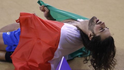 Gianmarco Tamberi of Italy celebrates after winning the men's high jump final during the European Athletics Indoor Championships at the Emirates Arena in Glasgow, Scotland, Saturday, March 2, 2019. (AP Photo/Petr David Josek)