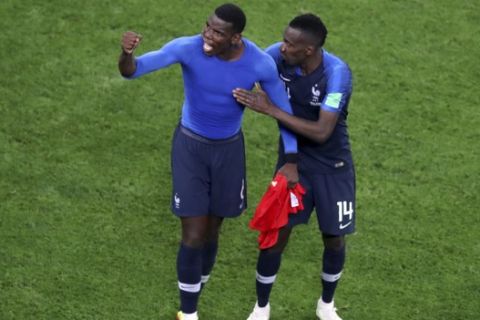France's Paul Pogba and Blaise Matuidi, right, celebrate at the end of the semifinal match between France and Belgium at the 2018 soccer World Cup in the St. Petersburg Stadium in St. Petersburg, Russia, Tuesday, July 10, 2018. (AP Photo/Thanassis Stavrakis)