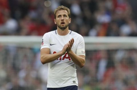 Tottenham's Harry Kane applauds after the English FA Cup semifinal soccer match between Manchester United and Tottenham at Wembley stadium in London, Saturday, April 21, 2018. (AP Photo/Kirsty Wigglesworth)