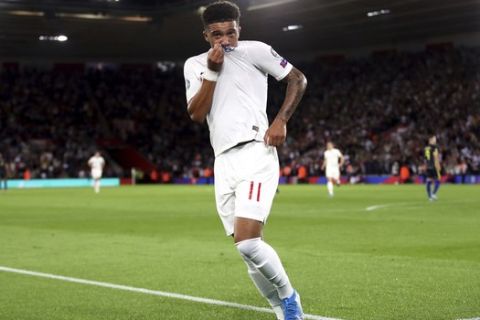 England's Jadon Sancho celebrates scoring his side's fourth goal of the game during the Euro 2020 group A qualifying soccer match between England and Kosovo at St Mary's Stadium in Southampton, England, Tuesday, Sept. 10, 2019. (Adam Davy/PA via AP)