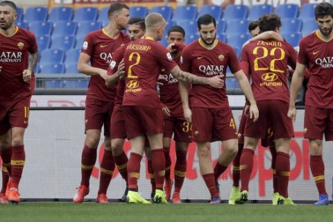 Roma's Nicolo' Zaniolo, 2nd left, celebrates with teammates after scoring his side's opening goal during a Serie A soccer match between Roma and Torino, at the Rome Olympic Stadium, Saturday, Jan. 19, 2019. (AP Photo/Andrew Medichini)
