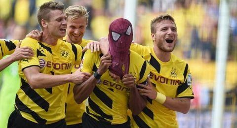 Dortmund's Italian striker Circo Immobile (R), Dortmund's Polish defender Lukasz Piszczek (L) celebrate after Dortmund's Gabonese striker Pierre-Emerick Aubameyang, who put on a Spiderman mark, scored the 2-0 goal during the German Supercup football match Borussia Dortmund vs Bayern Munich in the German city of Dortmund on August 13, 2014. AFP PHOTO / PATRIK STOLLARZ

DFL RULES TO LIMIT THE ONLINE USAGE DURING MATCH TIME TO 15 PICTURES PER MATCH. IMAGE SEQUENCES TO SIMULATE VIDEO IS NOT ALLOWED AT ANY TIME. FOR FURTHER QUERIES PLEASE CONTACT DFL DIRECTLY AT + 49 69 650050.PATRIK STOLLARZ/AFP/Getty Images
