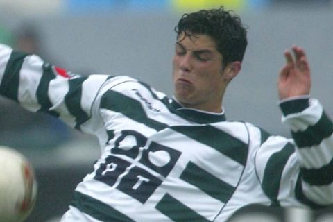 FC Porto's Brazilian striker Derlei Silva, left, shoots the ball with the opposition of Sporting's Cristiano Ronaldo, at Antas stadium, during their last Portuguese SuperLeague 2002/03 match, Sunday June 1, 2003 in Oporto, northern Portugal. Porto won 2-0 and conquested the Portuguese SuperLeague title, after winning the UEFA Cup 2003 against Glasgow Celtic in Sevilla, Spain. (AP Photo/Paulo Duarte)