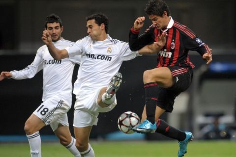 AC Milan's Brazilian forward Pato (R) fights for the ball with Real Madrid's defender Alvaro Arbeloa (C) and defender Raul Albiol during their UEFA Champions League football match at San Siro Stadium in Milan on November 3, 2009. The match ended in a 1-1 draw.  AFP PHOTO / Christophe Simon (Photo credit should read CHRISTOPHE SIMON/AFP/Getty Images)