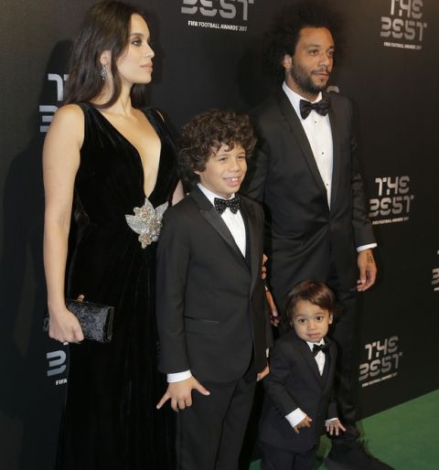 Brazilian soccer player Marcello and wife Clarisse Alves arrive with their children to attend The Best FIFA 2017 Awards at the Palladium Theatre in London, Monday, Oct. 23, 2017. (AP Photo/Alastair Grant)