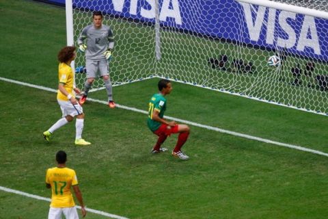 BRASILIA, BRAZIL - JUNE 23: Joel Matip of Cameroon scores his team's first goal past Julio Cesar of Brazil during the 2014 FIFA World Cup Brazil Group A match between Cameroon and Brazil at Estadio Nacional on June 23, 2014 in Brasilia, Brazil.  (Photo by Phil Walter/Getty Images)