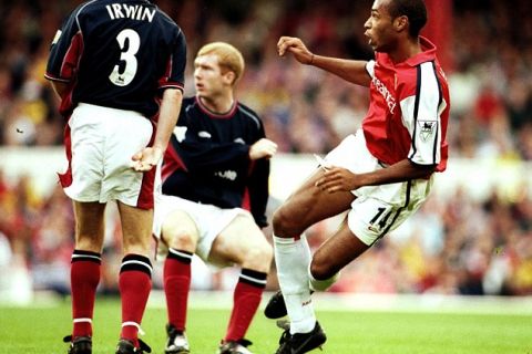 Arsenal's Thierry Henry scores the first goal of the game against Man Utd