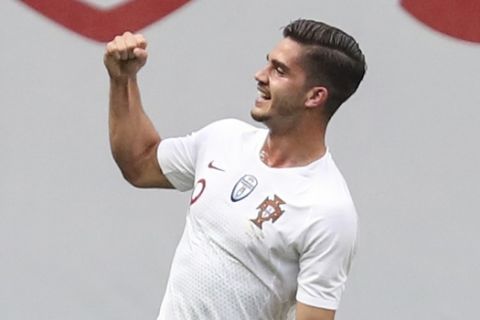 Portugal's Andre Silva celebrates after scoring the opening goal during a friendly soccer match between Portugal and Tunisia in Braga, Portugal, Monday, May 28, 2018. (AP Photo/Luis Vieira)