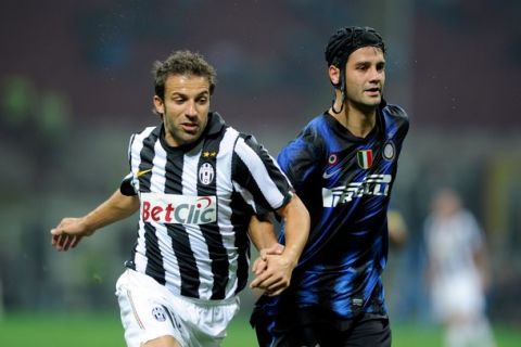 MILAN, ITALY - OCTOBER 03:  Christian Chivu of Inter Milan and Alessandro Del Piero of Juventus FC compete for the ball during the Serie A match between FC Internazionale Milano and Juventus FC at Stadio Giuseppe Meazza on October 3, 2010 in Milan, Italy.  (Photo by Claudio Villa/Getty Images)