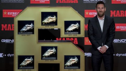 Barcelona soccer star Lionel Messi poses for the media after receiving his 6th Golden Boot award in Barcelona, Spain, Wednesday, Oct.16, 2019. (AP Photo/Joan Monfort)