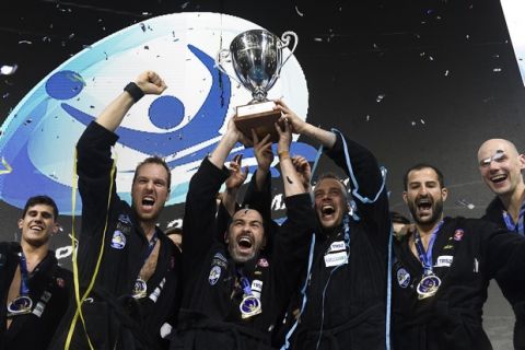 Players of Szolnoki VSK of Hungary celebrate with the trophy after they defeated Jug Dubrovnik of Croatia by 10-5 in the men's water polo Champions' League Final Six final match in Duna Arena in Budapest, Hungary, Saturday, May 27, 2017. (Tamas Kovacs/MTI via AP)