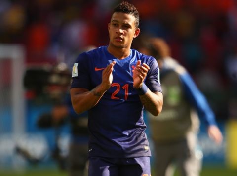 PORTO ALEGRE, BRAZIL - JUNE 18: Memphis Depay of the Netherlands acknowledges the fans after defeating Australia 3-2 during the 2014 FIFA World Cup Brazil Group B match between Australia and Netherlands at Estadio Beira-Rio on June 18, 2014 in Porto Alegre, Brazil.  (Photo by Ian Walton/Getty Images)