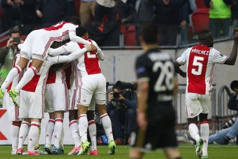 Ajax's players celebrate the second of their team during the first leg semi final soccer match between Ajax and Olympique Lyon in the Amsterdam ArenA stadium, Netherlands, Wednesday, May 3, 2017. (AP Photo/Peter Dejong)