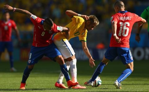 BELO HORIZONTE, BRAZIL - JUNE 28:  Arturo Vidal of Chile tussles Neymar of Brazil  during the 2014 FIFA World Cup Brazil round of 16 match between Brazil and Chile at Estadio Mineirao on June 28, 2014 in Belo Horizonte, Brazil.  (Photo by Quinn Rooney/Getty Images)