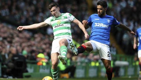 Rangers' Daniel Candeias challenges Celtic's Kieran Tierney, left, in action during their Scottish Premiership soccer match at Celtic Park in Glasgow, Scotland, Sunday March 31, 2019. (Andrew Milligan/PA via AP)