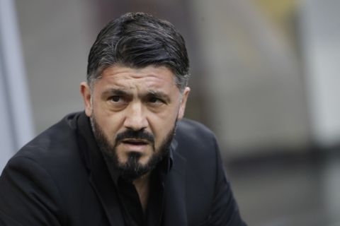 FILE - In this Saturday, Dec. 22, 2018 file photo, AC Milan coach Gennaro Gattuso waits for the start of a Serie A soccer match between AC Milan and Fiorentina, at the San Siro stadium in Milan, Italy. Amid reports of an imminent move to Chelsea and a mysterious fever, Gonzalo Higuain again lost his cool against his former club in what could have been his last match for AC Milan. Higuain was on the bench for most of Wednesday's Italian Super Cup against Juventus, officially due to "fever", but came on for the final 20 minutes. The Argentina forward had little impact and could not prevent 10-man Milan losing to Juventus but still made the headlines for the wrong reasons. (AP Photo/Luca Bruno, File )