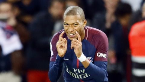 Paris Saint Germain's Kylian Mbappe reacts after scoring the second goal against Lyon during their French League One soccer match between PSG and Olympique Lyon at the Parc des Princes stadium in Paris, France, Sunday, Sept. 17, 2016. (AP Photo/Francois Mori)