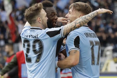 Lazio's Ciro Immobile, right, celebrates with Felipe Caicedo and Manuel Lazzari, left, after scoring his side's 3rd goal during a Serie A soccer match between Lazio and Spal at Rome's Olympic stadium, Sunday, Feb. 2, 2020. (AP Photo/Alessandra Tarantino)