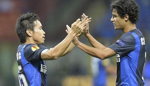 Inter Milan defender Yuto Nagatomo, of Japan, left, celebrates with his teammate Brazilian midfielder Coutinho after scoring, during an Europa League, Group H, soccer match between Inter Milan and Rubin Kazan at the San Siro stadium in Milan, Italy, Thursday, Sept. 20, 2012. The match ended in a 2-2 draw. (AP Photo/Luca Bruno)