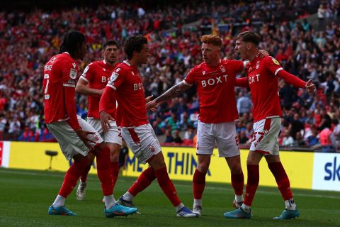 Nottingham Forest's team-players celebrates after Huddersfield Town's English defender Levi Colwill (unseen) scored an own goal during the English Championship play-off final football match between Huddersfield Town and Nottingham Forest at Wembley Stadium in London, on May 29, 2022. (Photo by Adrian DENNIS / AFP) / NOT FOR MARKETING OR ADVERTISING USE / RESTRICTED TO EDITORIAL USE  - NOT FOR MARKETING OR ADVERTISING USE / RESTRICTED TO EDITORIAL USE