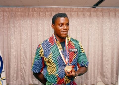 Carl Lewis of Houston, Texas, wears the Olympic gold medal which had previously been awarded to Ben Johnson of Canada, winner in a world record time of the 100-meter dash last week, in Seoul, South Korea, Oct. 1, 1988. After Johnson failed to pass a dope test, the Canadian sprinter lost his medal and the runner-up, Carl Lewis, was awarded the medal in a ceremony in Seoul. (AP Photo/Lennox McLendon)