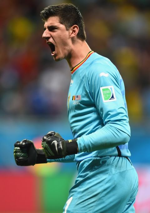 SALVADOR, BRAZIL - JULY 01:  Goalkeeper Thibaut Courtois of Belgium celebrates his team's first goal in extra time during the 2014 FIFA World Cup Brazil Round of 16 match between Belgium and the United States at Arena Fonte Nova on July 1, 2014 in Salvador, Brazil.  (Photo by Jamie McDonald/Getty Images)