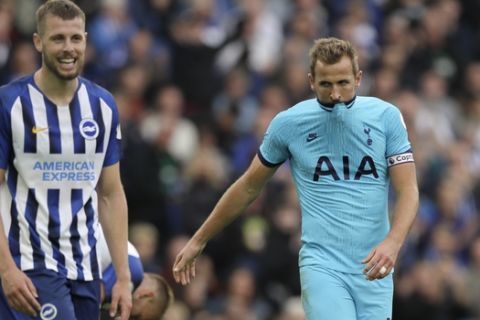 Tottenham's Harry Kane, right, is dejected after missing an opportunity to score during the English Premier League soccer match between Brighton and Hove Albion and Tottenham Hotspur at Falmer stadium in Brighton, England Saturday, Oct. 5, 2019. (AP Photo/Kirsty Wigglesworth)