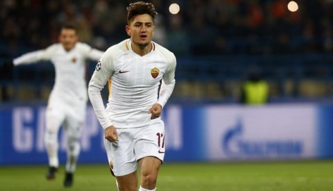 Roma's Cengiz Under, center, celebrates after scoring his side's opening goal during the Champions League, round of 16, first-leg soccer match between Shakhtar Donetsk and Roma at the Metalist Stadium in Kharkiv, Ukraine, Wednesday, Feb. 21, 2018. (AP Photo/Efrem Lukatsky)