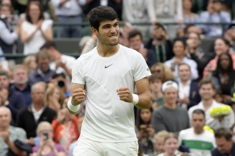 Spain's Carlos Alcaraz reacts after beating Jeremy Chardy of France in a first round men's singles match on day two of the Wimbledon tennis championships in London, Tuesday, July 4, 2023. (AP Photo/Kirsty Wigglesworth)